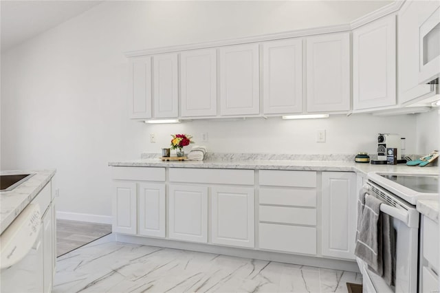 kitchen featuring light stone counters, white appliances, white cabinetry, baseboards, and marble finish floor