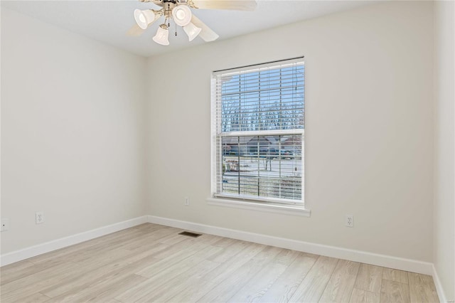 spare room with plenty of natural light, visible vents, and light wood-style flooring