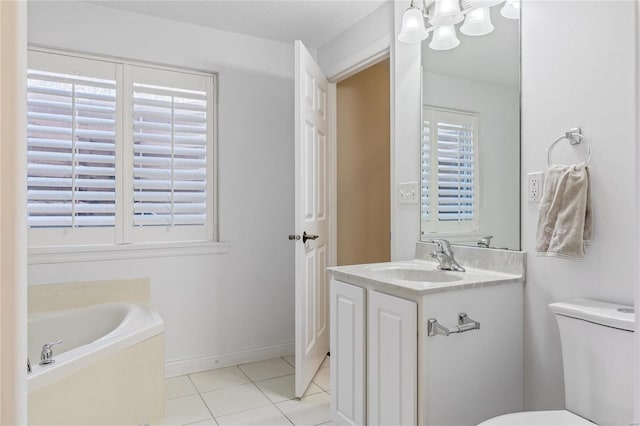 full bathroom featuring tile patterned floors, toilet, vanity, baseboards, and a bath