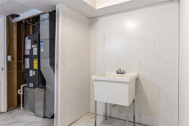 bathroom with marble finish floor