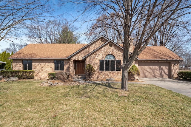 ranch-style home featuring a front yard, a shingled roof, concrete driveway, a garage, and brick siding