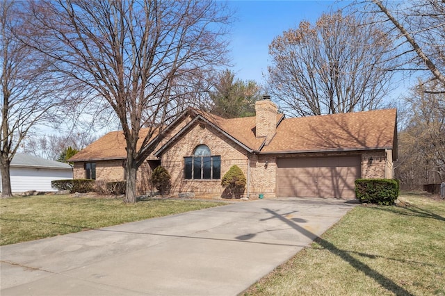 single story home with driveway, an attached garage, a chimney, a front lawn, and brick siding