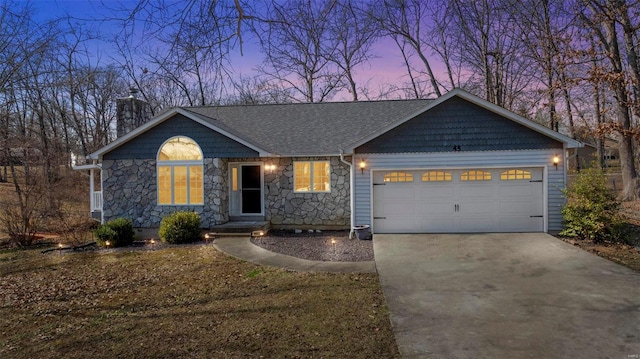 single story home featuring a chimney, stone siding, concrete driveway, and a garage