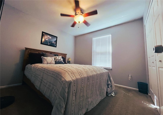 bedroom with a ceiling fan, baseboards, and carpet floors