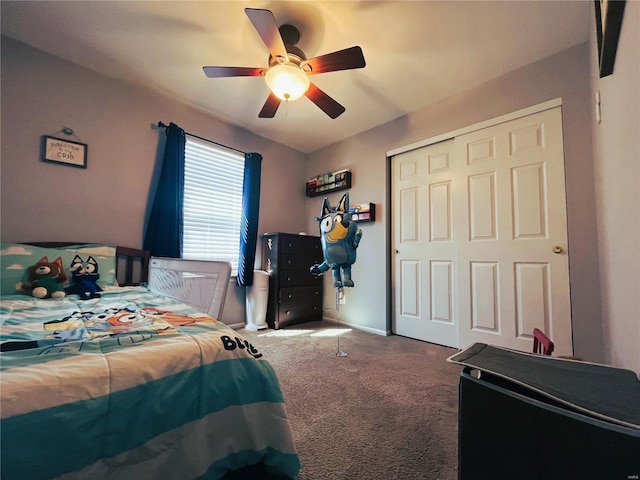 carpeted bedroom with a ceiling fan and a closet