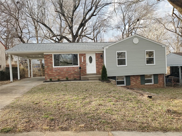 view of front of property with fence, an attached carport, and brick siding