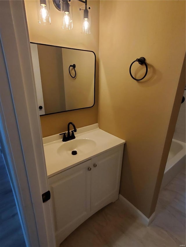 bathroom featuring vanity and baseboards