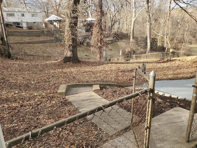 view of yard featuring fence and a gate