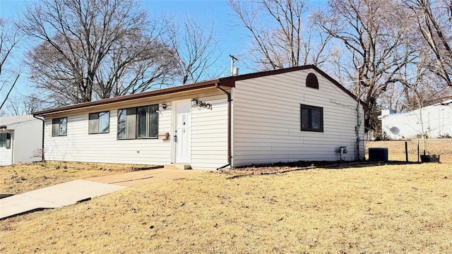 ranch-style house with central AC unit and fence