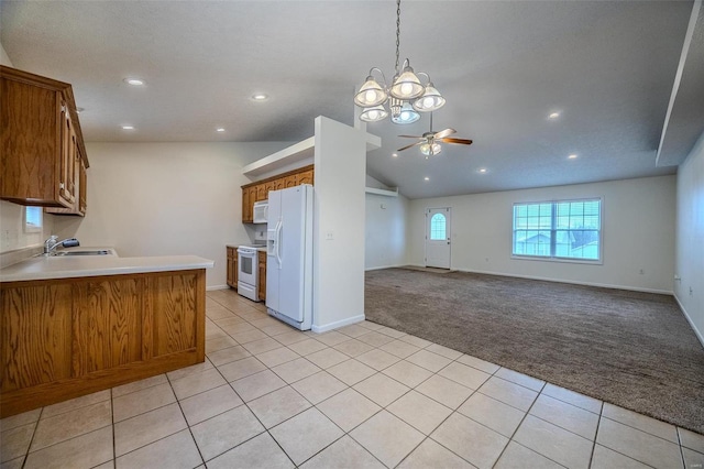 kitchen with light carpet, white appliances, a ceiling fan, brown cabinets, and light tile patterned flooring