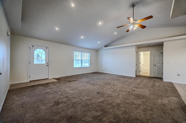 interior space featuring lofted ceiling, ceiling fan, a textured ceiling, recessed lighting, and baseboards