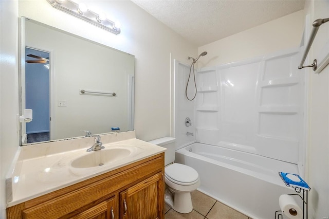 bathroom featuring bathing tub / shower combination, toilet, vanity, a textured ceiling, and tile patterned floors