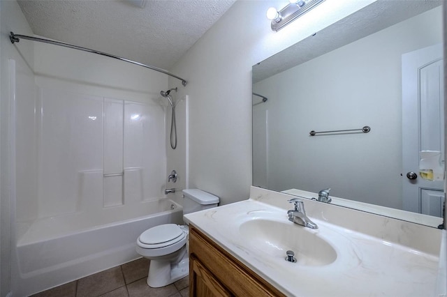 bathroom with toilet,  shower combination, tile patterned flooring, a textured ceiling, and vanity