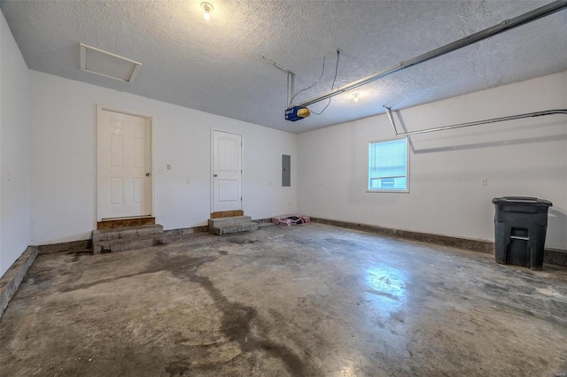 garage featuring electric panel, baseboards, and a garage door opener