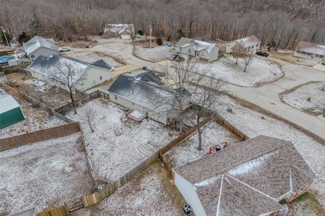 drone / aerial view featuring a view of trees