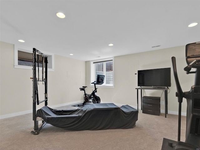 exercise area with carpet flooring and recessed lighting