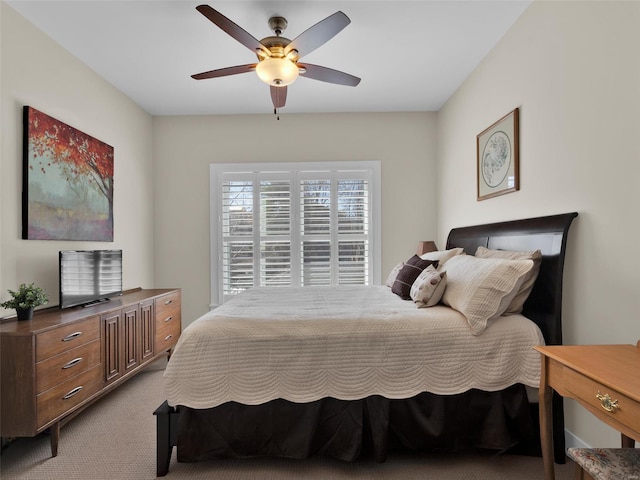 bedroom with light carpet and ceiling fan