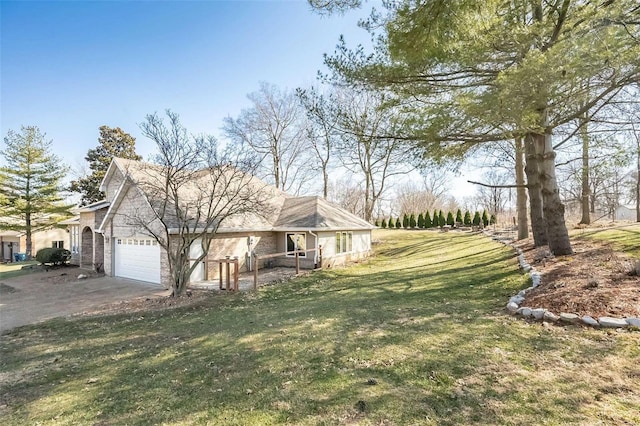 view of front of house with brick siding, driveway, an attached garage, and a front yard