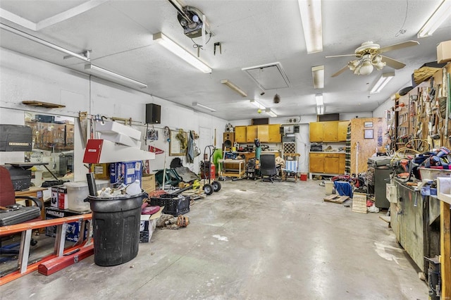 garage with ceiling fan and a workshop area