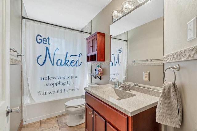 bathroom featuring tile patterned floors, shower / bath combo with shower curtain, toilet, and vanity