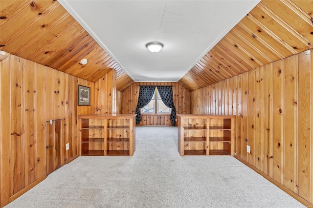 additional living space with carpet, wooden ceiling, wooden walls, and vaulted ceiling