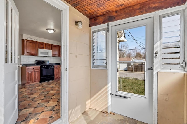 entryway with wood ceiling