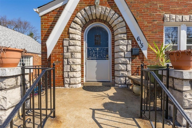 property entrance with brick siding