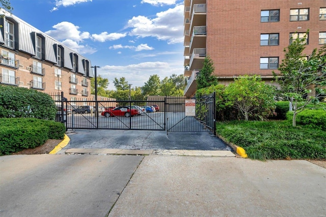 view of gate featuring fence