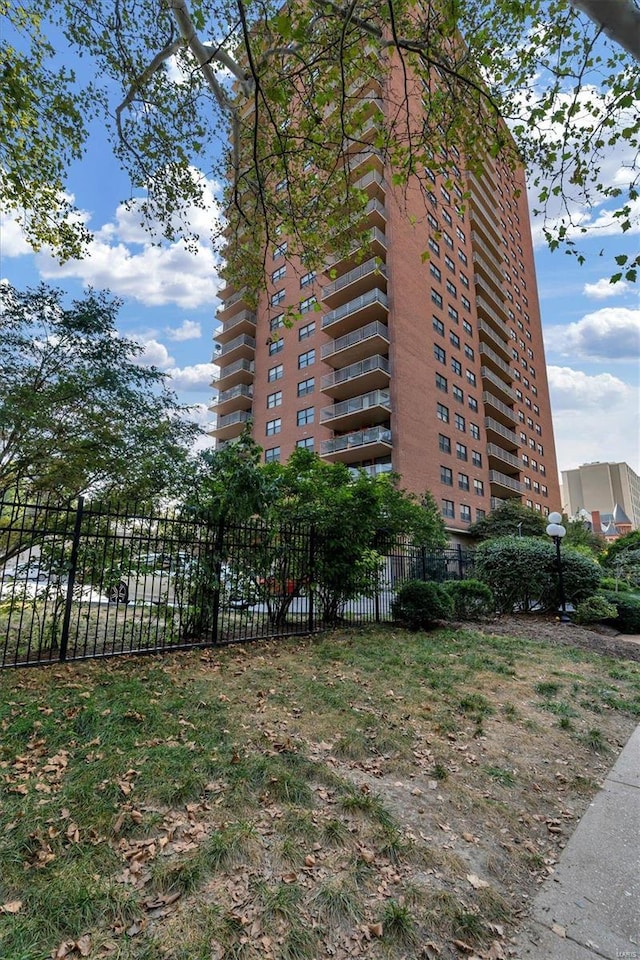 view of building exterior with fence