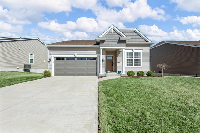 view of front of house featuring a front lawn, concrete driveway, an attached garage, and central AC unit