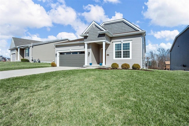 view of front of property featuring a front lawn, driveway, and an attached garage