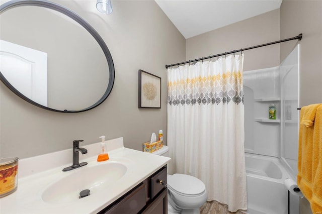 full bath featuring shower / tub combo, vanity, and toilet