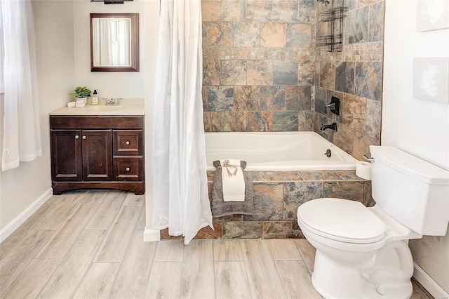 full bathroom with vanity, toilet, tiled shower / bath, and wood tiled floor