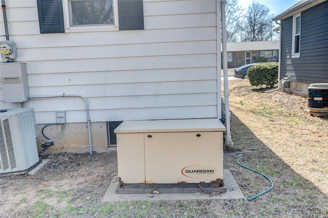 exterior details with a power unit, central AC unit, and electric meter