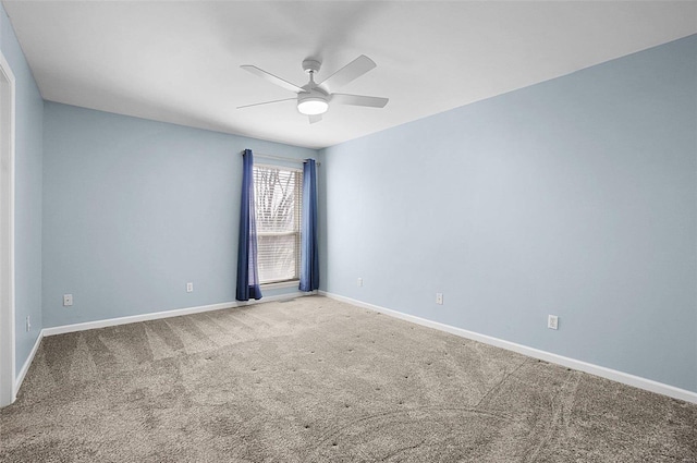 empty room featuring baseboards, carpet, and ceiling fan