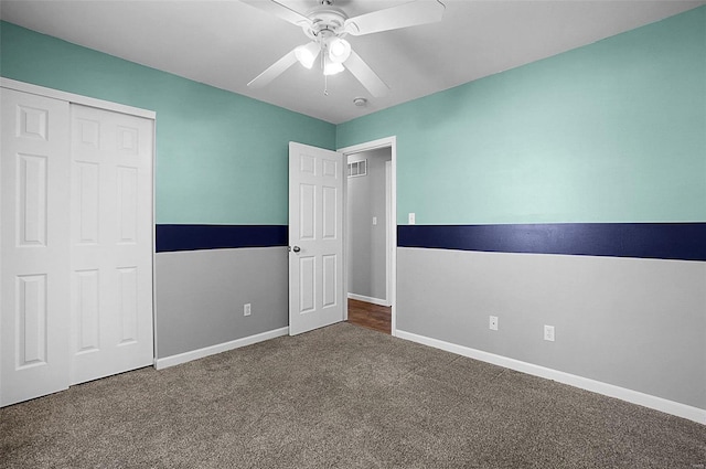 unfurnished bedroom with visible vents, baseboards, carpet floors, a closet, and a ceiling fan