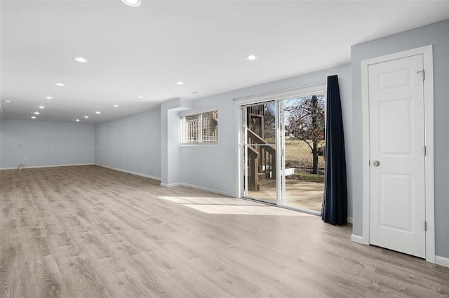 unfurnished room with recessed lighting, baseboards, and light wood-style floors