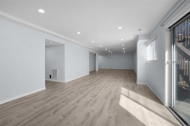 unfurnished room featuring recessed lighting, visible vents, baseboards, and light wood-style floors