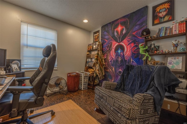 office with a textured ceiling and wood finished floors