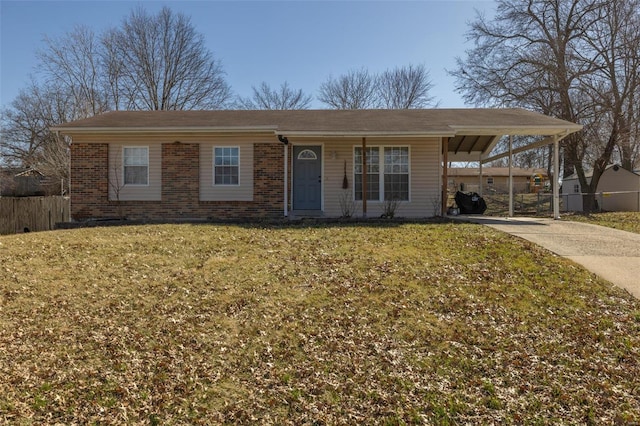 ranch-style home featuring an attached carport, brick siding, fence, driveway, and a front yard