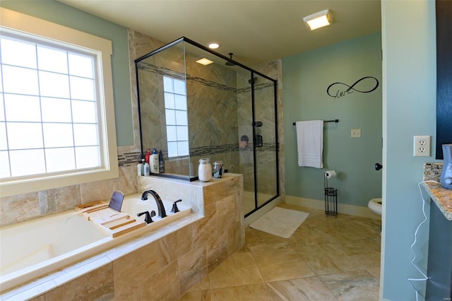 bathroom with toilet, a shower stall, a bath, and baseboards