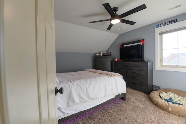 bedroom featuring visible vents, carpet floors, ceiling fan, and vaulted ceiling