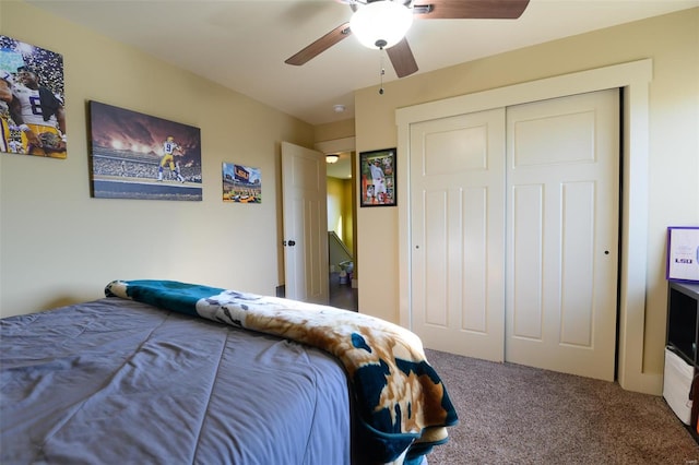 carpeted bedroom featuring a closet and a ceiling fan