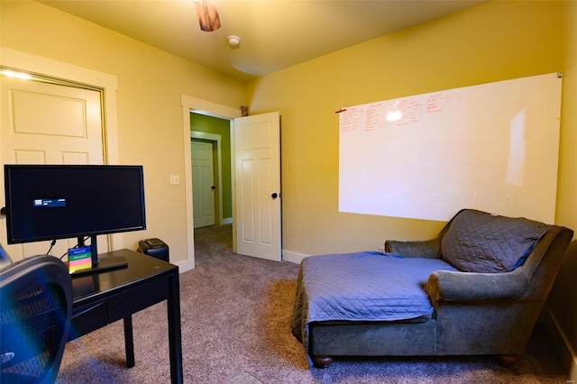 carpeted bedroom featuring baseboards