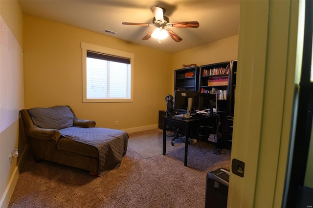 office with visible vents, baseboards, ceiling fan, and carpet floors