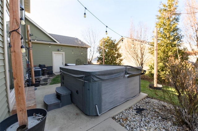 view of yard featuring a patio and a hot tub