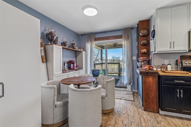 interior space featuring light wood-style floors and backsplash