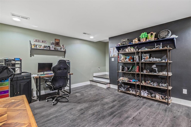 home office featuring baseboards, visible vents, and wood finished floors