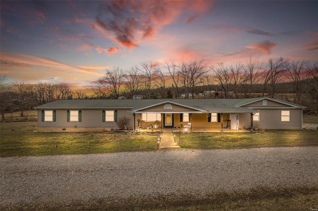 view of front of property featuring crawl space, covered porch, and a front lawn