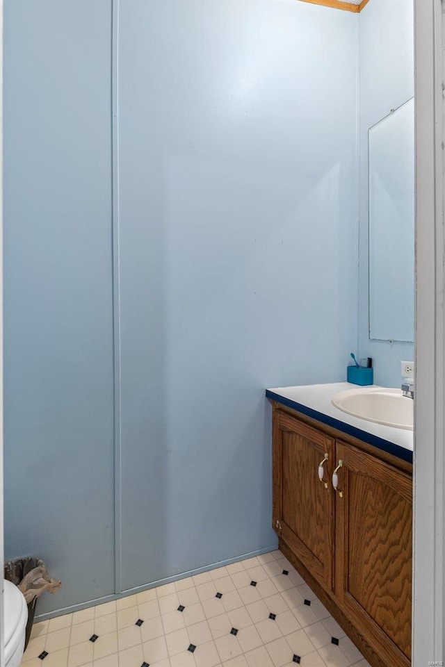 bathroom with vanity, toilet, and tile patterned floors